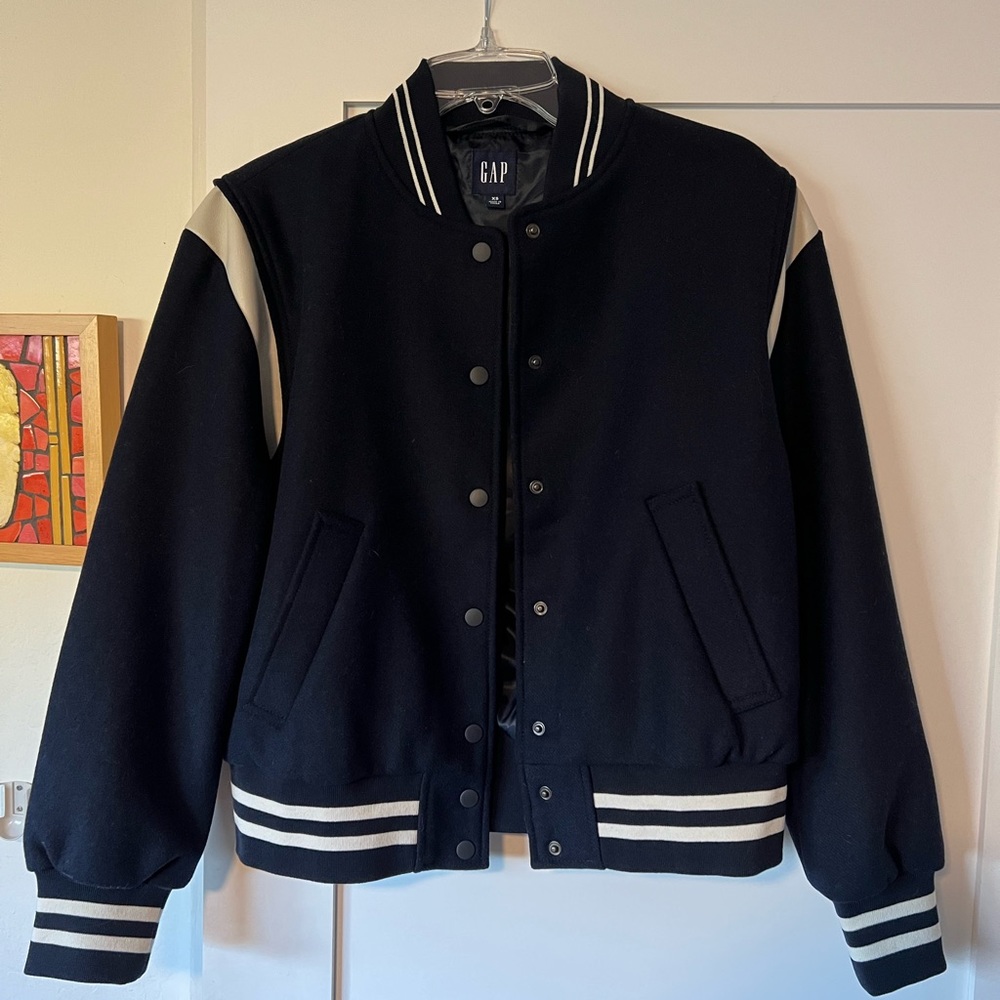 NWOT. Never worn. Gap wool varsity jacket. Fully lined.Navy blue/white.Men’s XS.